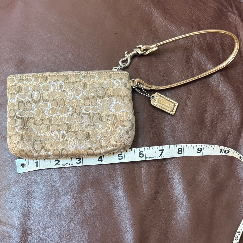 Coach Metallic Gold Signature Wristlet Pouch  Very pretty! In great Condition